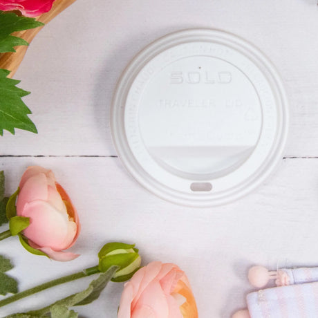 Dart Solo 12-24 oz. White HIPS Plastic Traveler® Lid with Sip Hole - Case of 1200 - #TL1224TG Dart Container