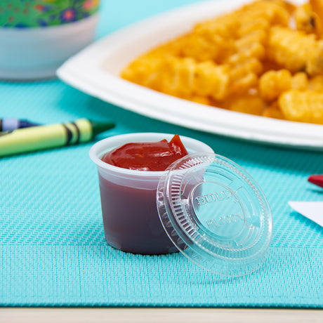 Dart Solo Clear 1 oz. PET Plastic Soufflé Cup Lid - Case of 2500 - #PL100N