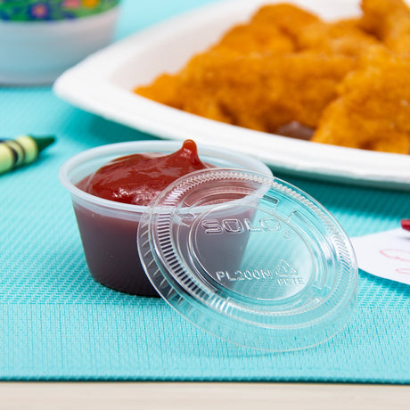 Dart 2 oz. PET Clear Plastic Soufflé Cup Lid - Case of 2500 - #PL200N