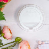 Dart Solo 12-24 oz. White HIPS Plastic Traveler® Lid with Sip Hole - Case of 1200 - #TL1224TG